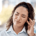 Adult experiencing tinnitus — ringing in the ears guide by DEB’s Audiology, Borivali West Mumbai