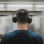 Young adult wearing headphones — guide to safe listening and hearing protection from DEB’s Audiology Mumbai